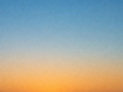 A gradient of light transitioning from warm orange to cool blue